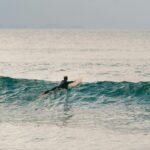 An adventurous surfer captures the thrill of surfing at Byron Bay, New South Wales, Australia.