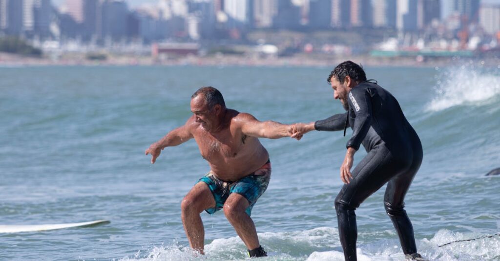 Two men surfing the waves together in Mar del Plata, Argentina.